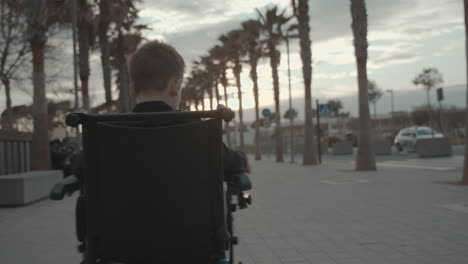 handicapped child spinning in electric wheelchair