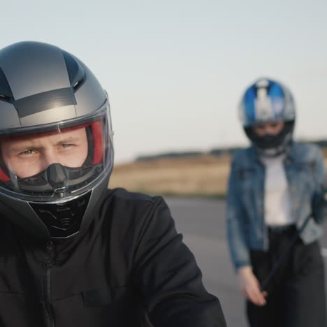 a young female biker in a helmet