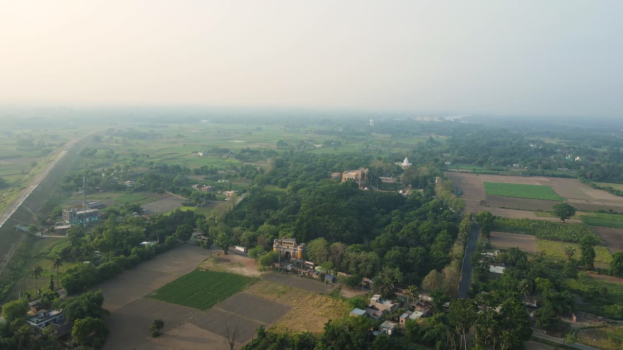 Aerial drone shot of Hazarduari Palace in Murshidabad, showcasing its grand architecture and lush grounds.