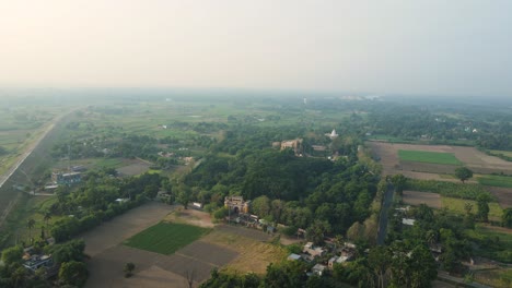 aerial drone shot of hazarduari palace in murshidabad, showcasing its grand architecture and lush grounds.