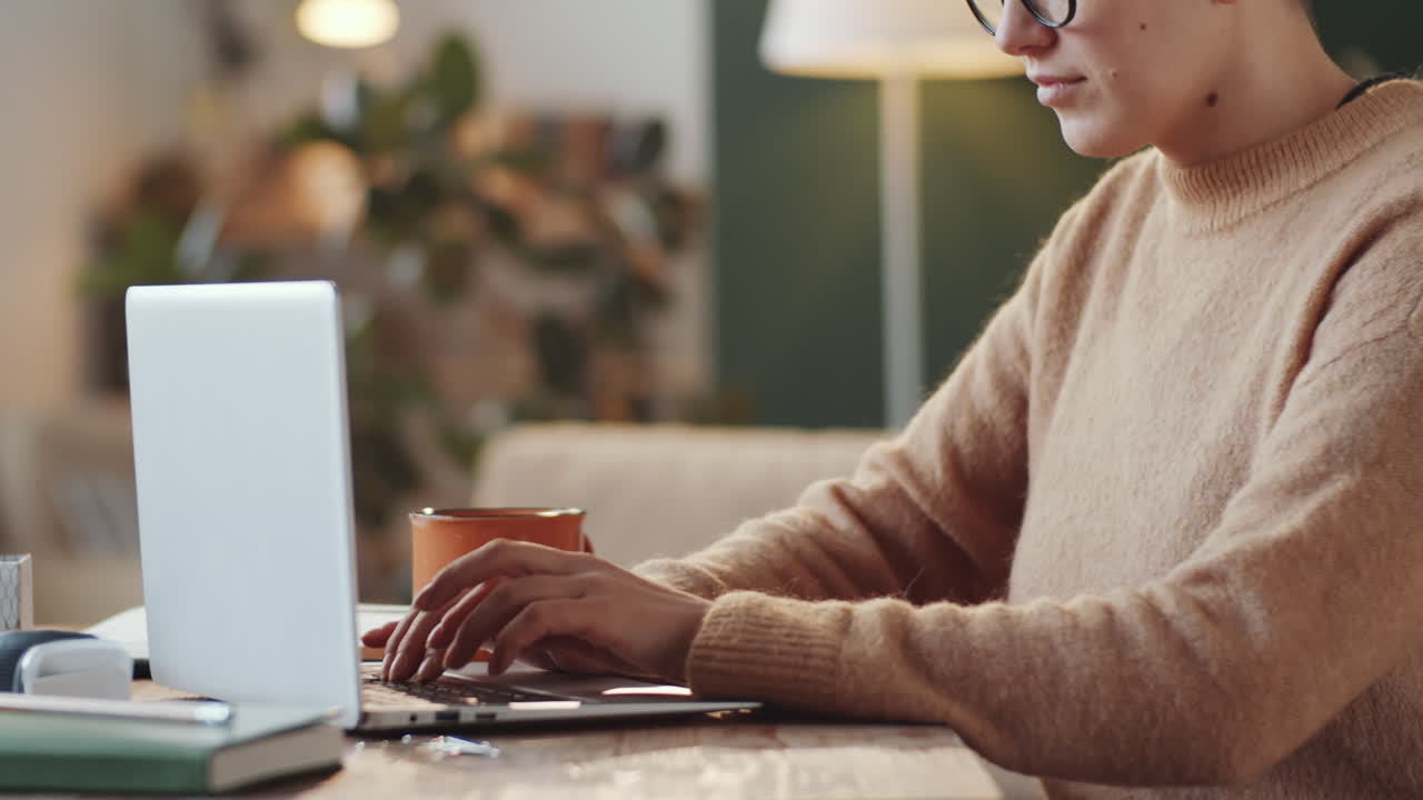 Woman working on a laptop at home
