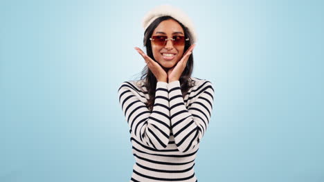 fashion, sunglasses and woman wink in studio