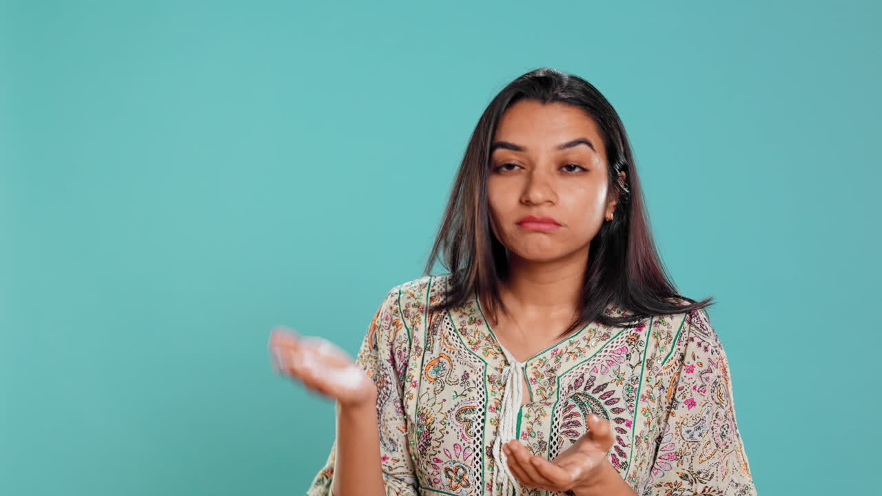 Resentful sassy person rolling eyes and applauding in jest, feeling irritated