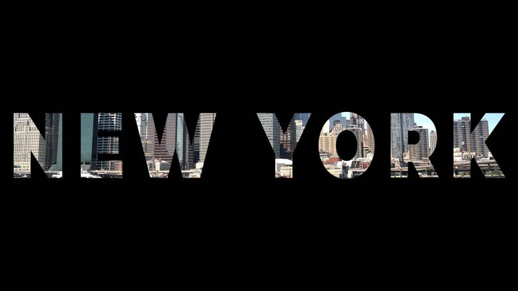Shot Of Manhattan Buildings And Skyline In America Overlaid With Graphic Spelling Out New York
