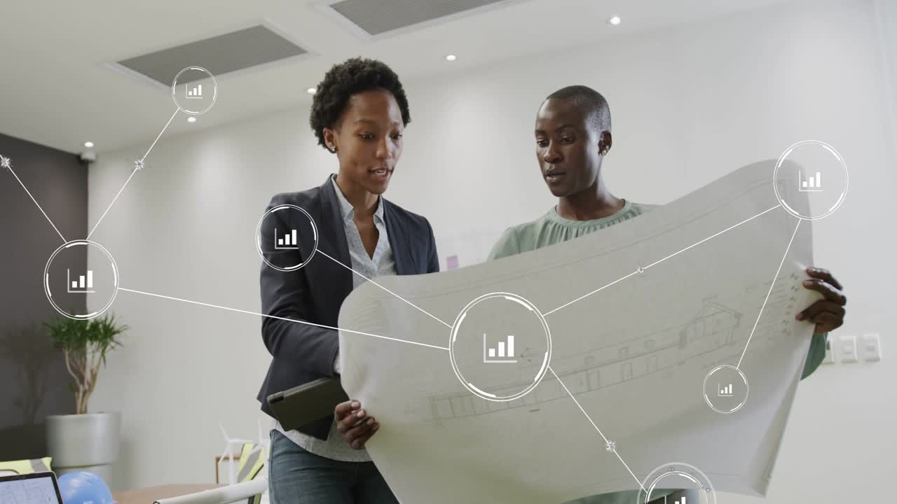 Two colleagues reviewing blueprint, left tapping tablet and pointing, interacting with data nodes