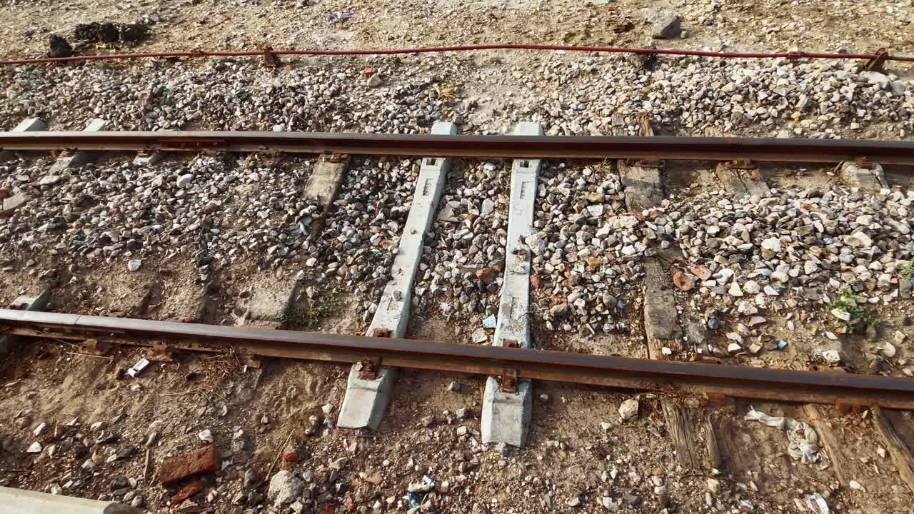 View of stone chips on train track. Day view