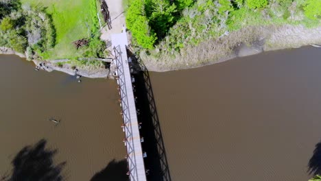 aerial video on the heights of the bridge over the stream