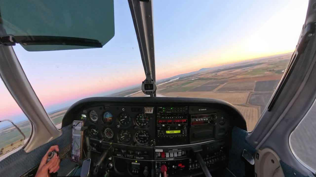 Golden hour flight in a general aviation aircraft over Northern California’s fields. Stunning rural terrain meets vibrant skies in this scenic sunset captured from above