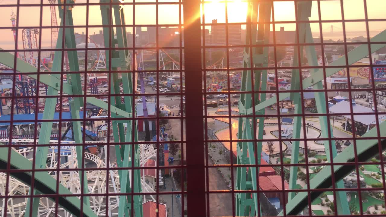 looking out of the ferris wheel at Coney Island, Brooklyn, NY at sunset.