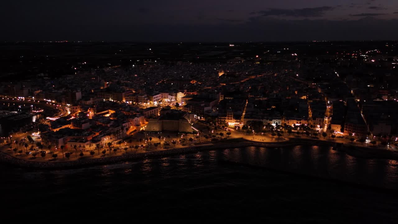 Mola di Bari township at night, aerial panoramic view