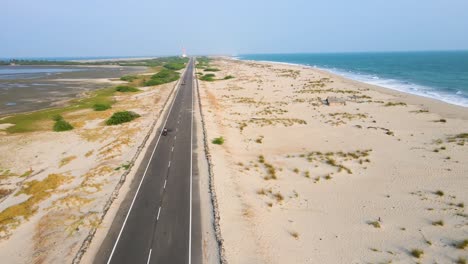 Immersive aerial drone shot of Dhanushkodi, showcasing the abandoned town and its stunning natural surroundings.