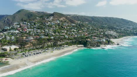 Approaching-aerial-view-of-Aliso-Beach-park,-in-Orange-County-California