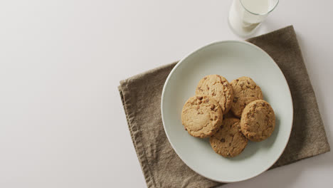 video of biscuits with chocolate and milk on white background