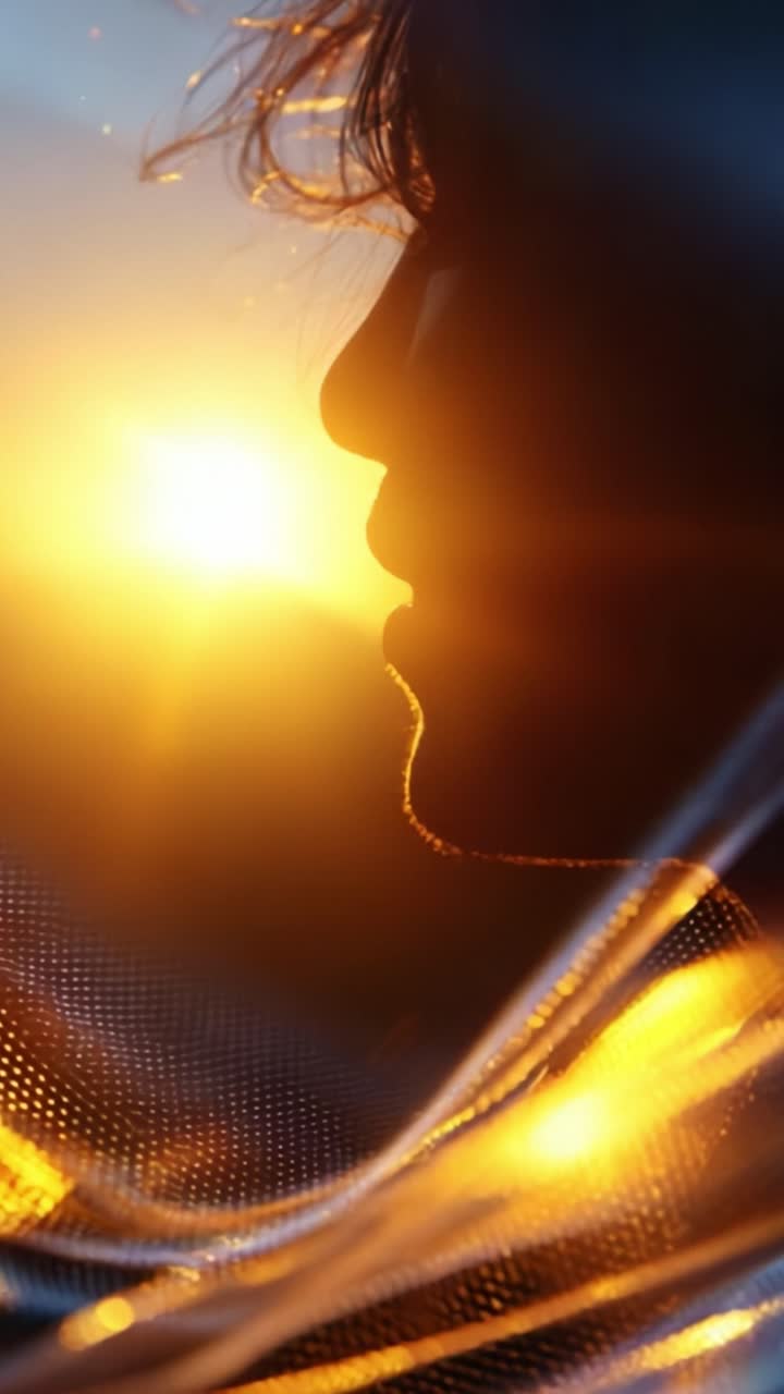 A Captivating Silhouette of a Person Against the Backdrop of a Glorious Sunset, Radiating Vibrant Hues of Orange and Yellow, Creating an Ethereal and Dreamy Atmosphere that Evokes Emotion and Reflection
