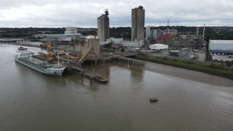 Ship-Loading-at-jetty-Hanson-Ready-mixed-Concrete-site-Erith-Kent-UK-Aerial-footage