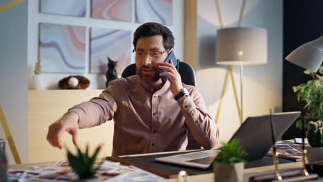 happy business consultant calling smartphone at corporate closeup. phone talking