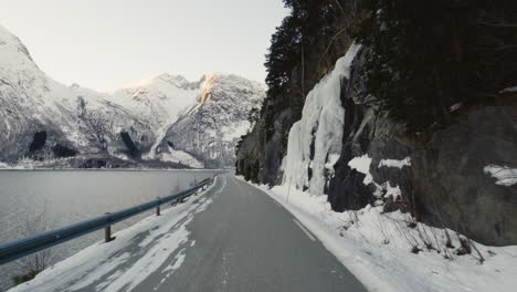 scenic view of the snowy mountains in eresfjord norway - moving shot