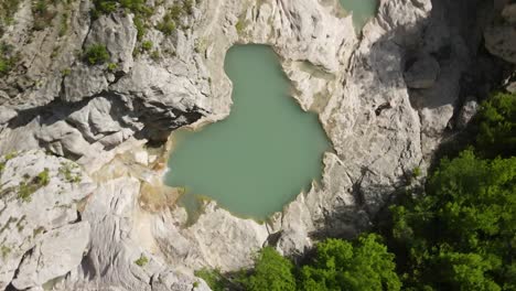 rotary motion drone headshot of albanian canyon "syri i ciklopit