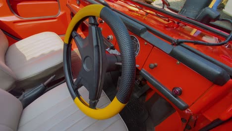 Close-up-shot-of-steering-wheel-car-of-a-classic-car-Volkswagen-Type-181,182-or-Kurierwagen-or-Trekker