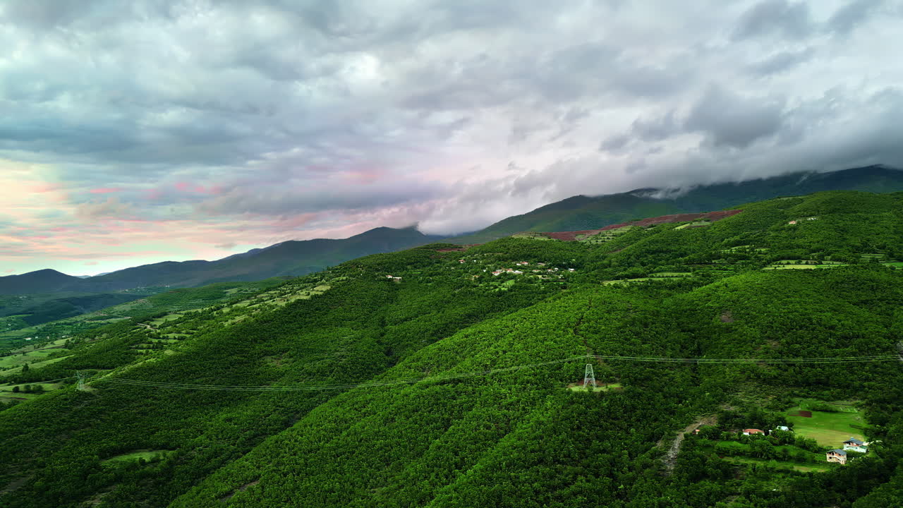 Aerial, drone view of mountains and green fields in North Macedonia