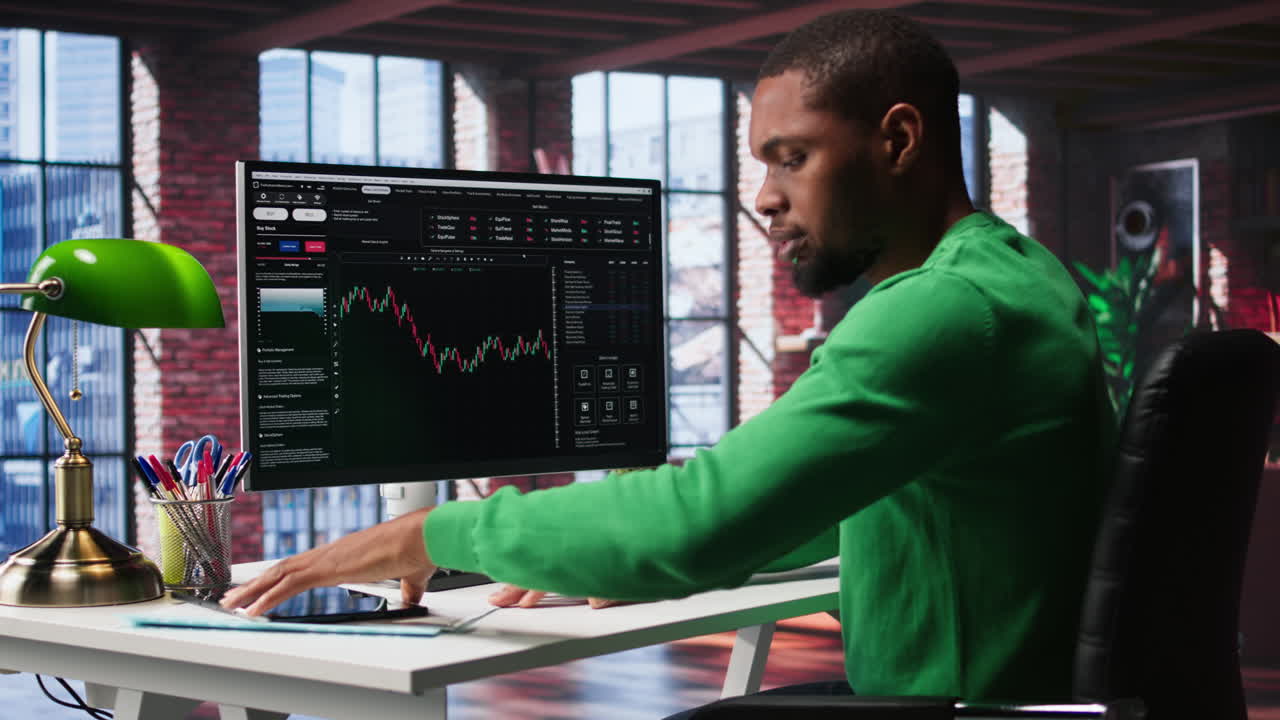 Vertical Video Day trader uses computer to purchase stocks that might perform well