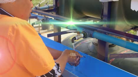 animation of red light spots over african american woman washing hands outdoors at standpipe