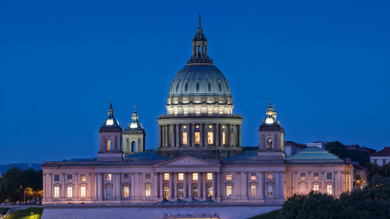 Grand domed building illuminated at twilight
