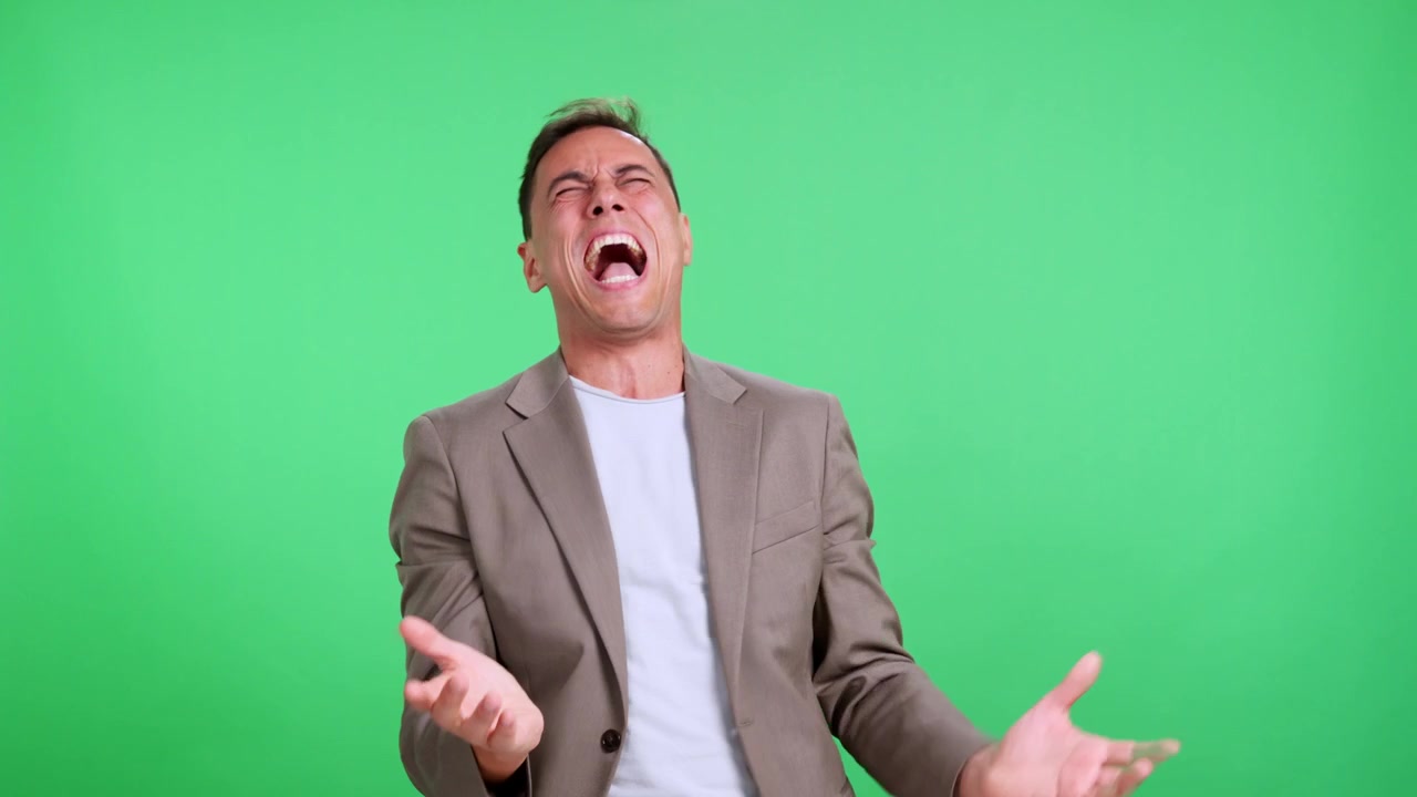 Hysterical man laughing out loud uncontrollably