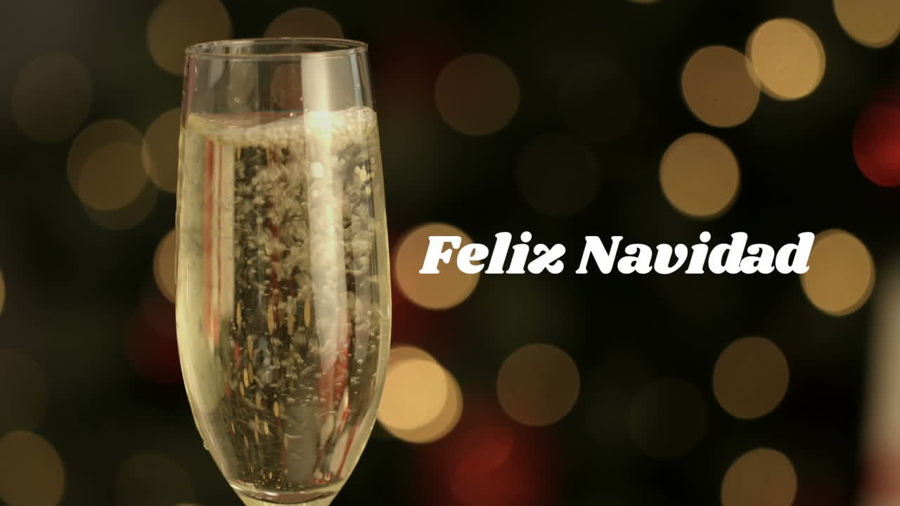 Feliz Navidad sobre una copa de champán