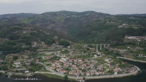 aerial perspective of the city of baião with the majestic aqueduct in the background in baião crossing the douro river in portugal