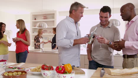 group of mature friends enjoying dinner party shot on r3d