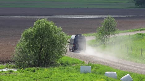 Country-side-panoramic-landscape-in-summer-time-from-above-and-ground-with-hay-rolls-and-roads