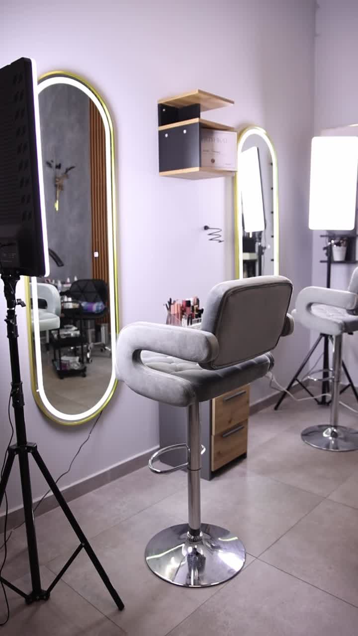 Makeup room with bar stools and mirrors