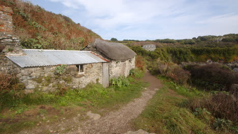 looking-at-old-fisherman's-cottage-at-Bessy's-Cove,-The-Enys,-cornwall