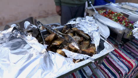 Food-and-chickens-on-large-plates-on-the-table---pan-right