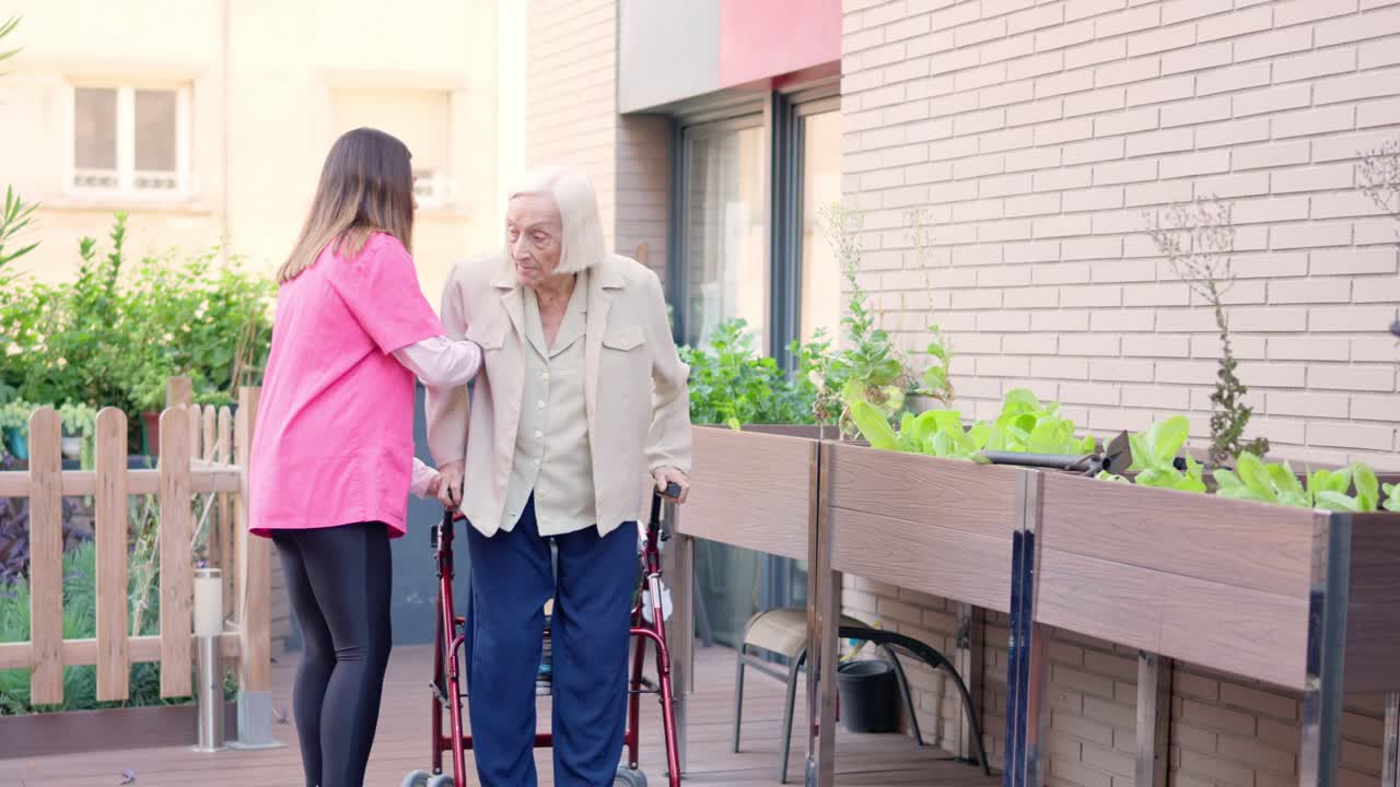 Elderly woman assisted by caregiver in community garden
