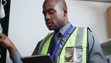 Cyber-security,-tablet-and-black-man-in-server