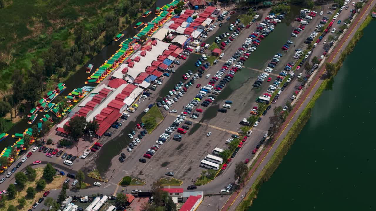 Crowded Xochimilco canals with full parking lots on a saturday in CDMX