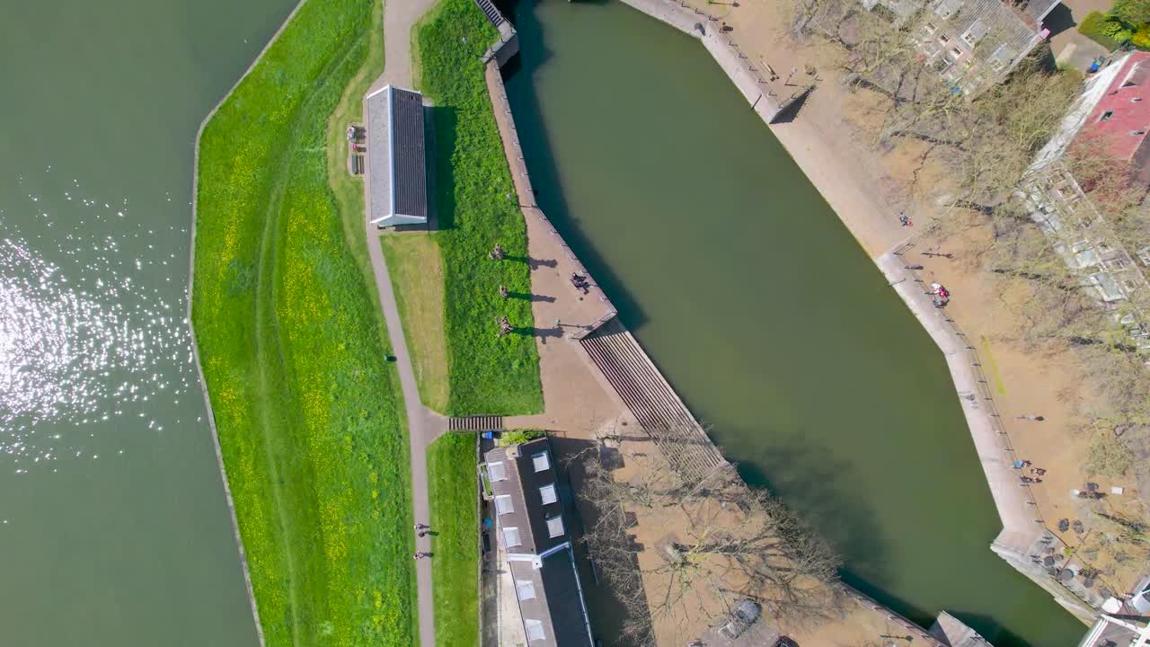 Descending aerial view of canal bank