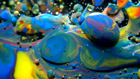 slow motion bright colors bubbles oil beautiful paint universe color moving multicolored closeup. acrylic paint. fantastic surface. abstract colorful paint metamorphosis structure colorful bubbles