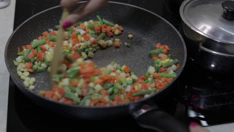 pan fry meal of delicious asparagus, pepper, corn and carrot. vegetarian meal