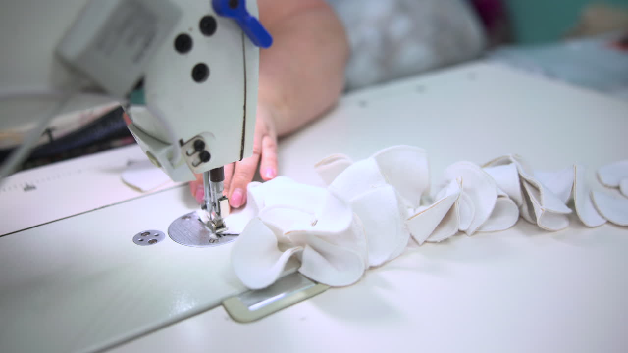 Ruffle Sewing On Industrial Machine. Operator Guides Gathered Fabric Under Needle To Form Decorative Pleats. Media