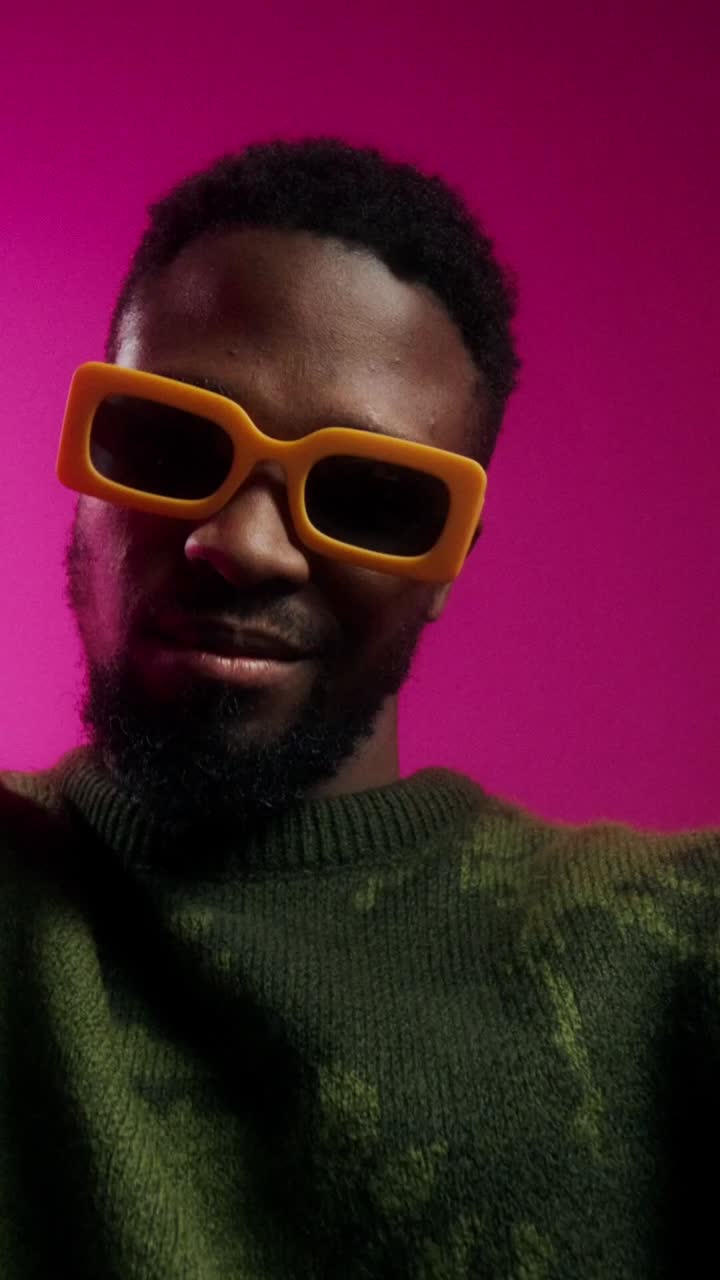 Stylish Man in Trendy Sunglasses and Sweater