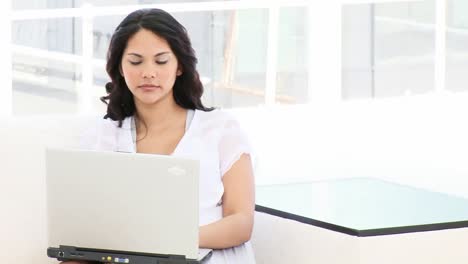 Young-business-woman-working-at-a-laptop