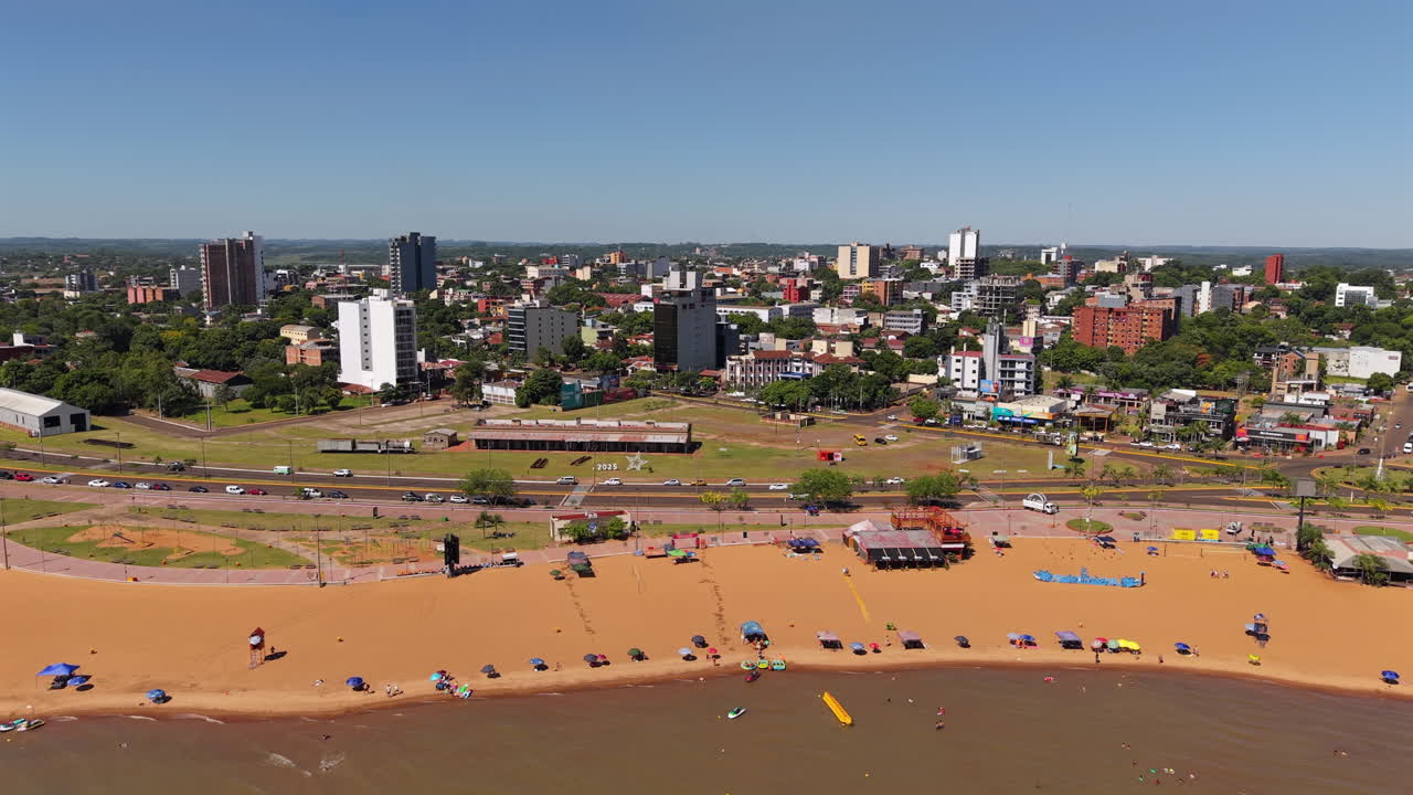 A captivating aerial view of Encarnación city in Paraguay with a stunning coastline along San José Beach.