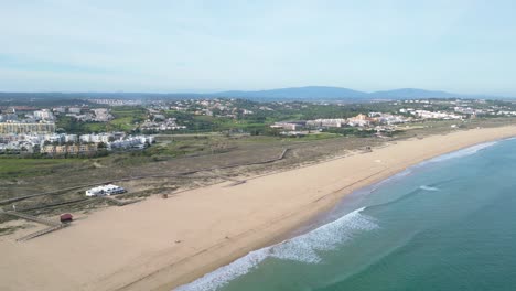 Praia de são roque beach in lagos, showcasing dunes and serene coastline, aerial view