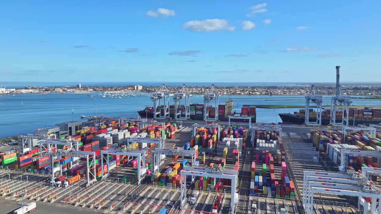 Aerial view of cranes ships and stacked containers at Victoria International Container Terminal