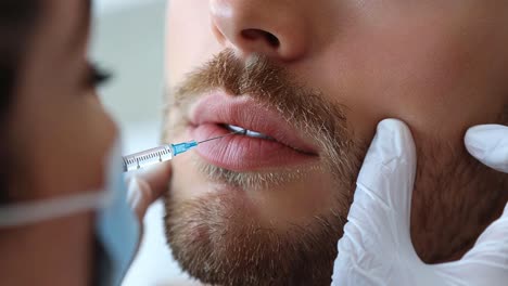 man receiving lip filler injection