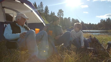 grandfather, son and grandson relaxing on a fishing trip