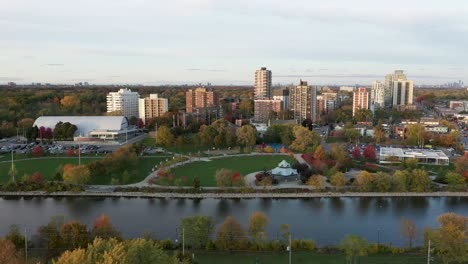 aerial shot flying along the coast of lake ontario showing downtown mississauga at sunrise